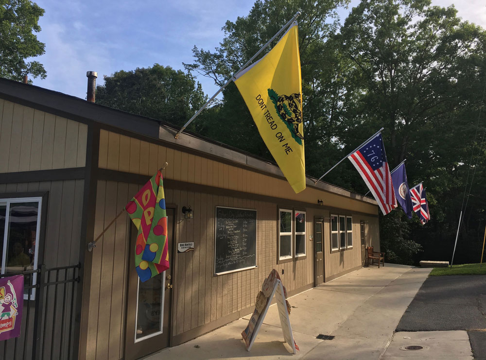 KOA Williamsburg VA building with flags