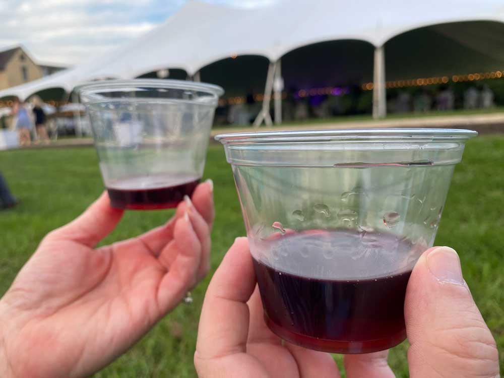 Red wine in plastic cups at the Williamsburg Winery Midsummer Night's Party