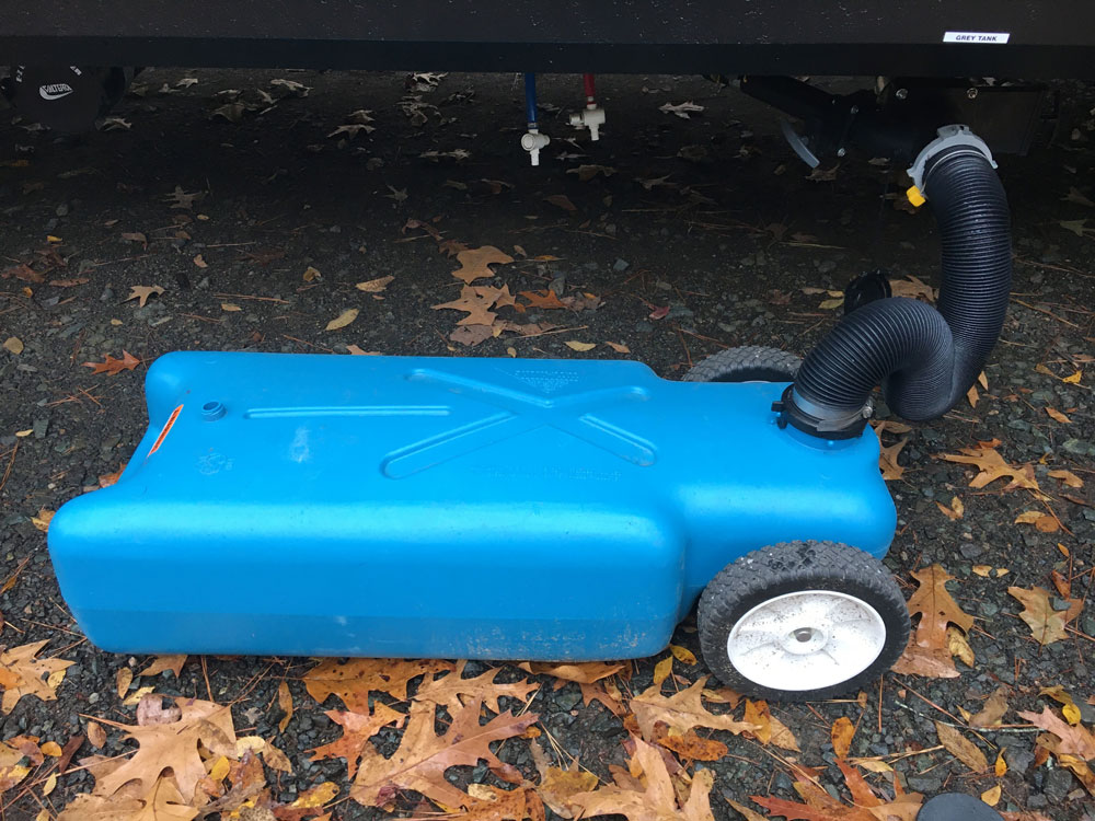 RV Tote Tank Connected To Camper Sewer Hookup