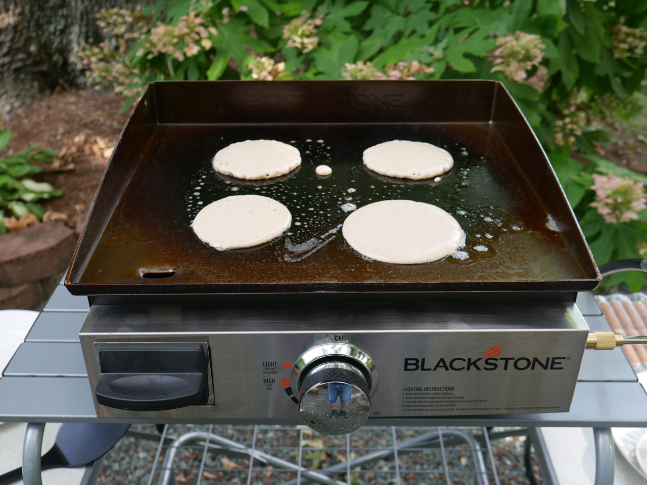 blackstone griddle with four pancakes