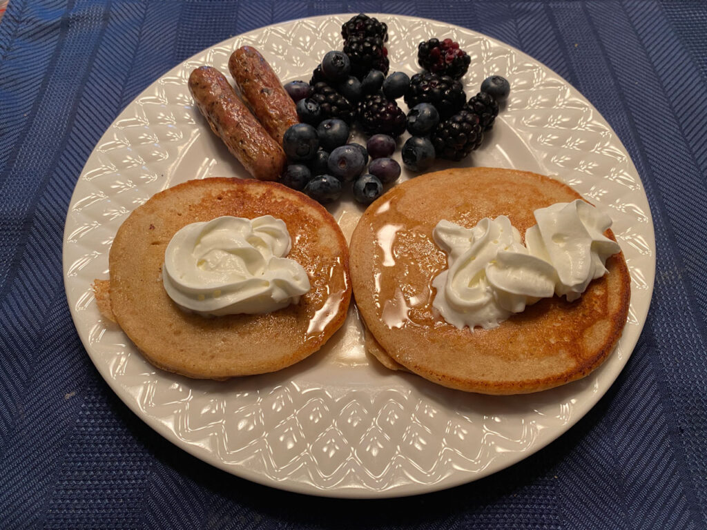 pancakes sausage breakfast cooked on a blackstone griddle