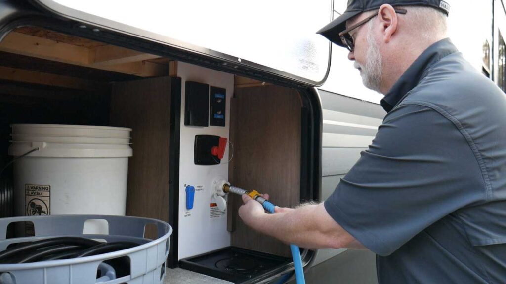Connect a Freshwater Hose to Help With Dewinterizing a Travel Trailer
