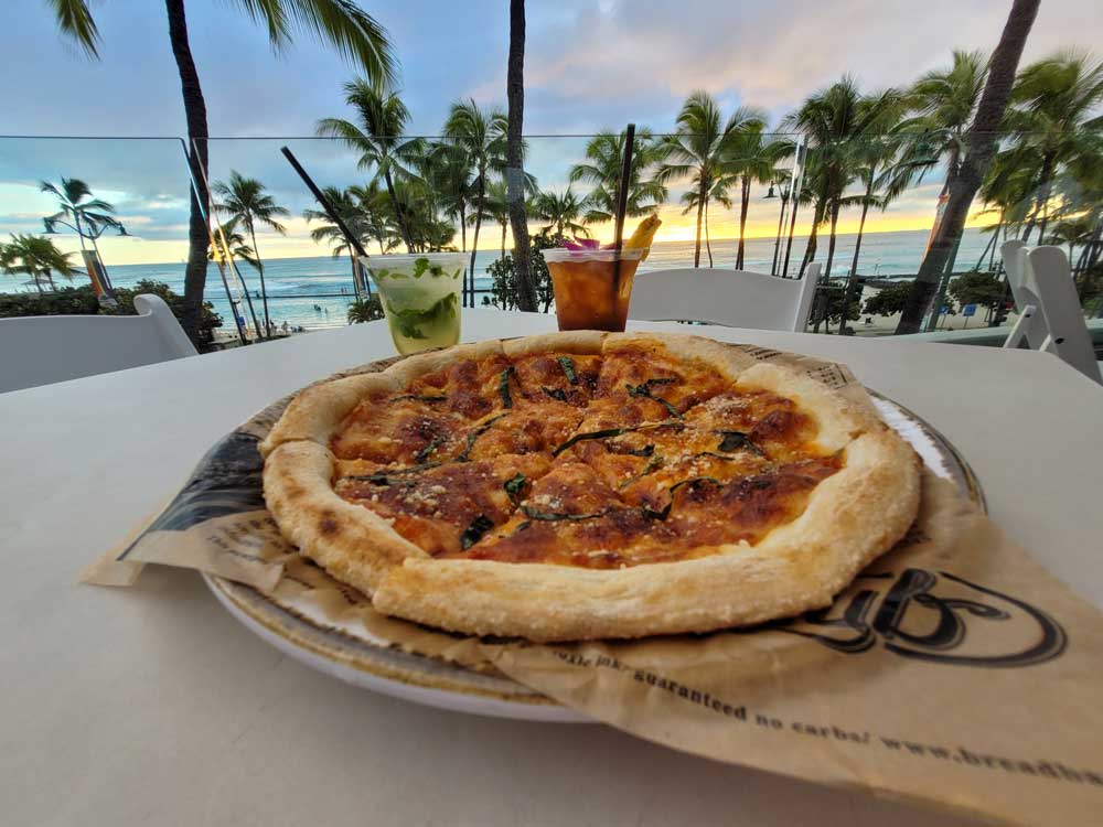 Pizza with a view of the Pacific Ocean at Queensbreak Marriott Waikiki