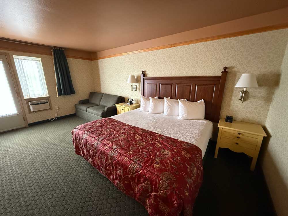Room with king bed and sofa at Pike's Waterfront Lodge Fairbanks Alaska