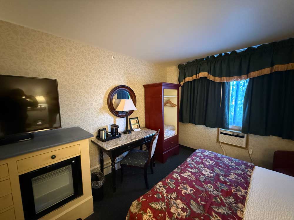 View of desk, coffee maker, and wardrobe in room at Pike's Waterfront Lodge Fairbanks Alaska