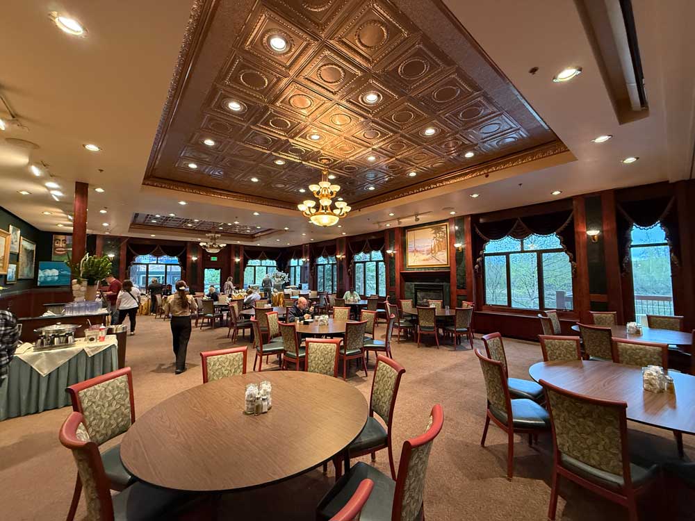 Dining room with large round tables at Pike's Waterfront Lodge Fairbanks Alaska