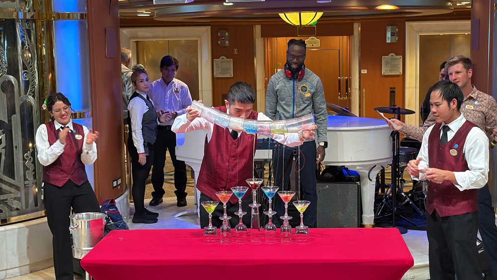 Bartender pouring multiple cocktails on the Sapphire Princess