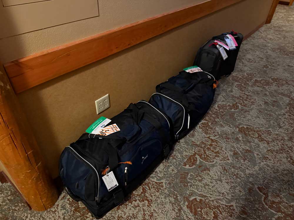 Luggage placed in hallway for transportation to next Princess lodge.