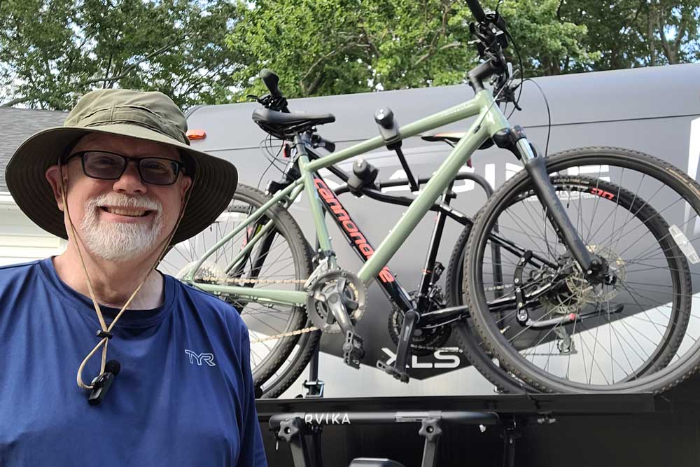 Erling by bicycles on an Arvika travel trailer bicycle rack