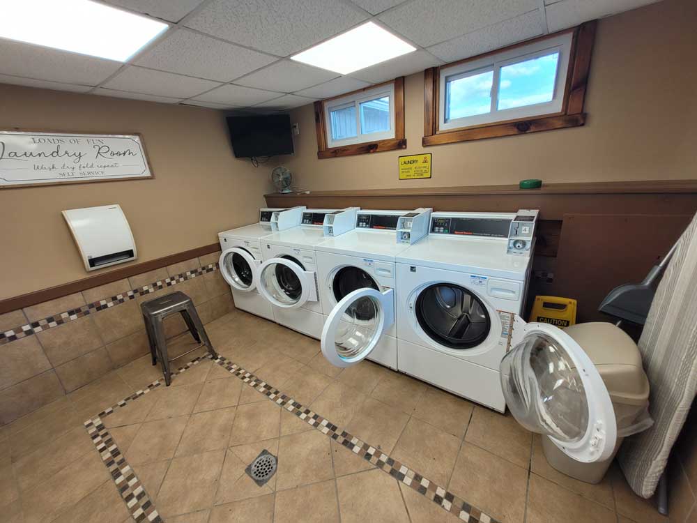 Four washing machines in the laundry room at KOA Williamsport