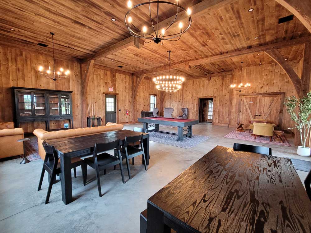 Clubhouse seating, pool table, and game area at Finger Lakes RV Resort