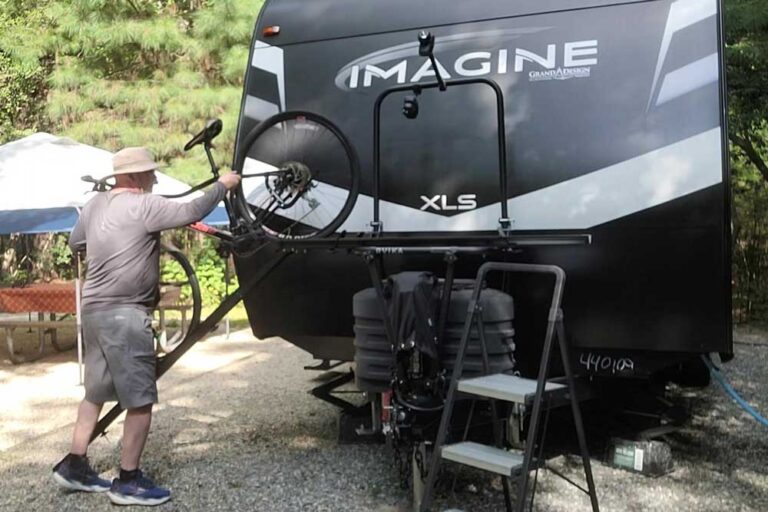 Loading bike on travel trailer bike rack using ramp